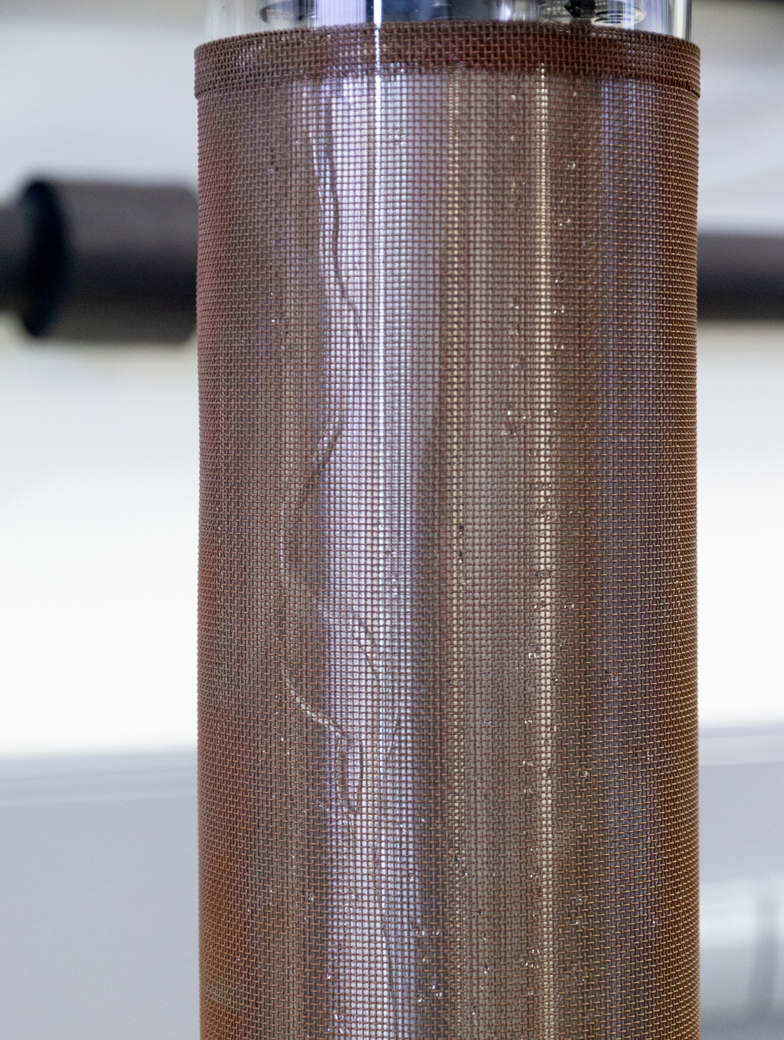 Detail of a coaxial DBD reactor with water film. 