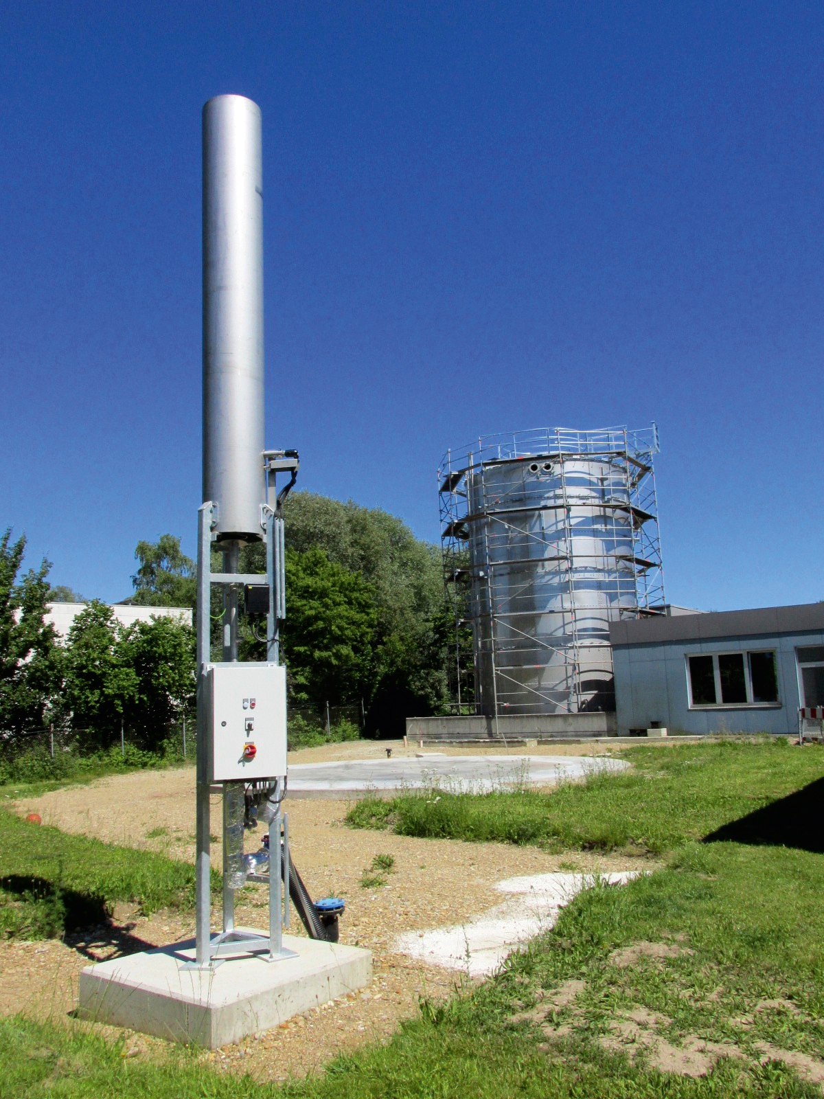 High-load digestion under construction with emergency flare in the foreground.