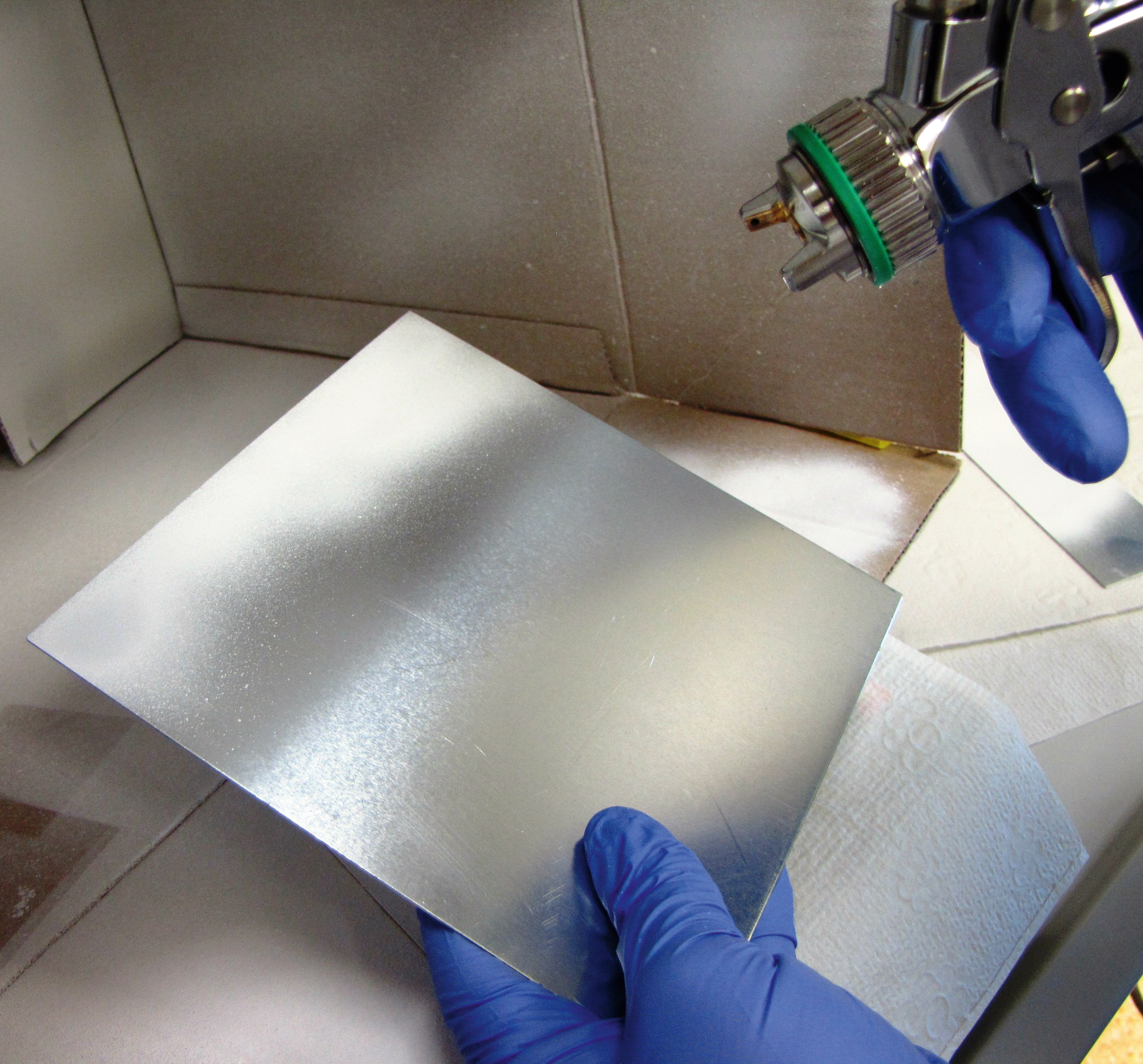 Application of the developed coating via spray gun. Application of the developed coating via spray gun.