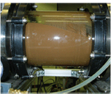 Laboratory module of the rotating disk filter with concentrated excess sludge after the end of filtration, which is no longer flowable at 4.5% dry residue.